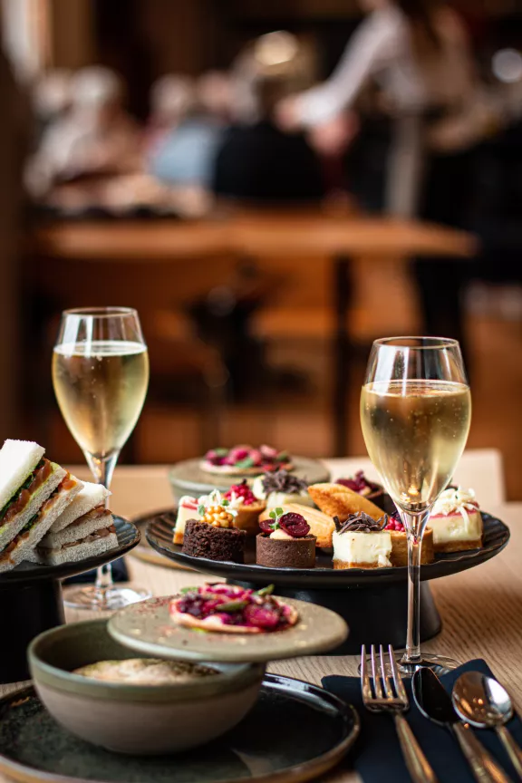 A royal tea with delicacies and glasses of cava