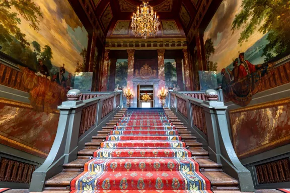 The grand staircase of Paleis Het Loo with the mural in the background designed by Daniel Marot and painted by Robert Duval