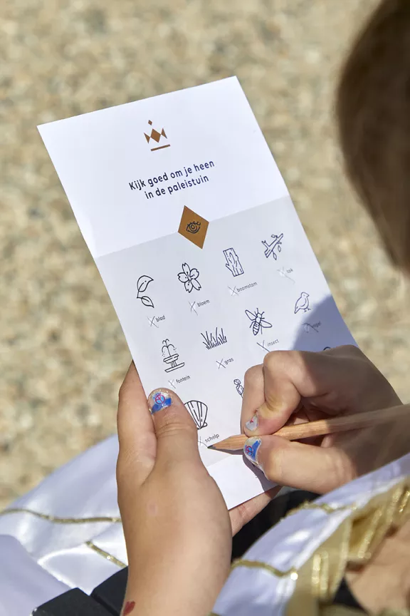 A child doing a treasure hunt in the gardens