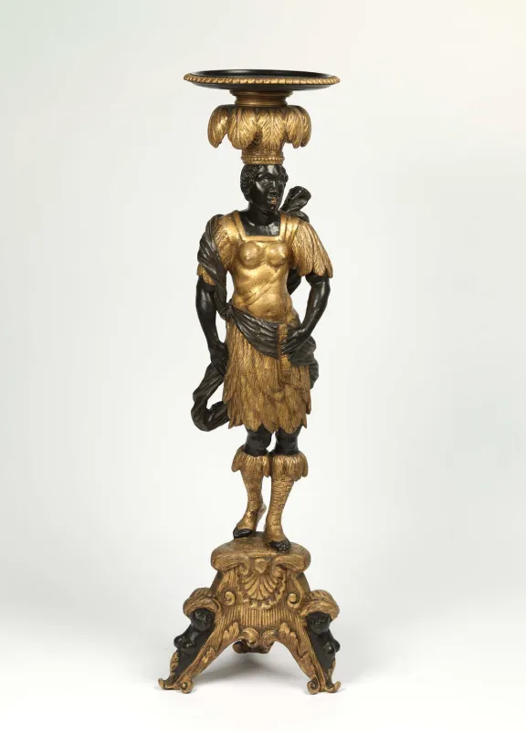 Small table with a single leg in the shape of a Black person carrying a tray on their head, wearing a golden dress.
